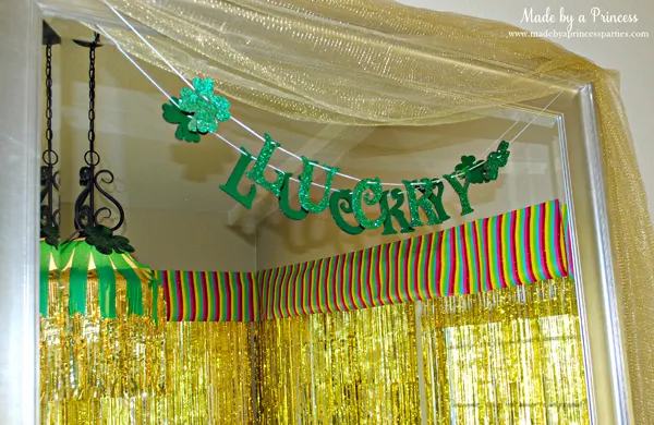 Kids St Patricks Day Party Ideas glitter LUCKY banner and rainbow wrapping paper window valances