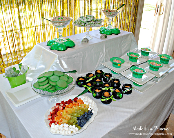 Kids St Patricks Day Party Ideas table with snack mix and Lucky Charms and green mini pancakes