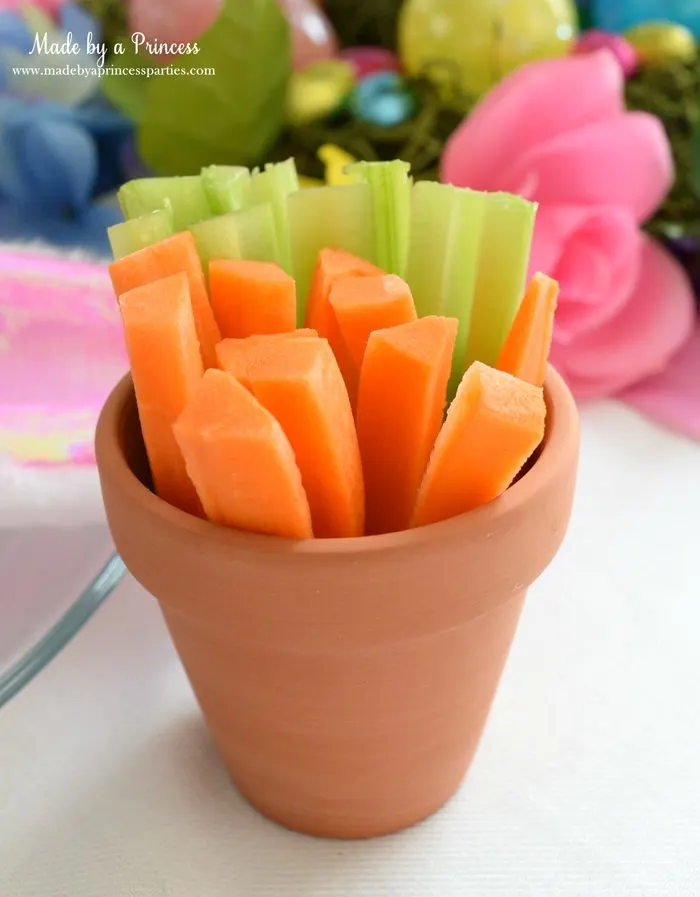budget friendly easter ideas carrots in celery in clay pot