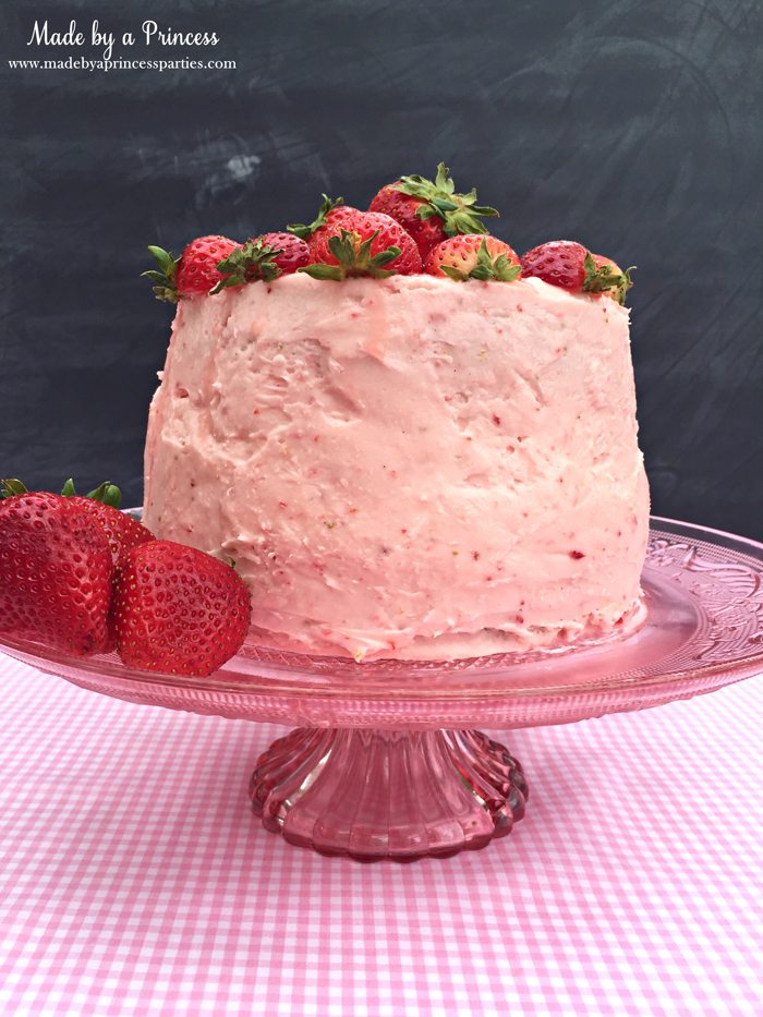 strawberry lemonade cake cream cheese frosting on cake plate