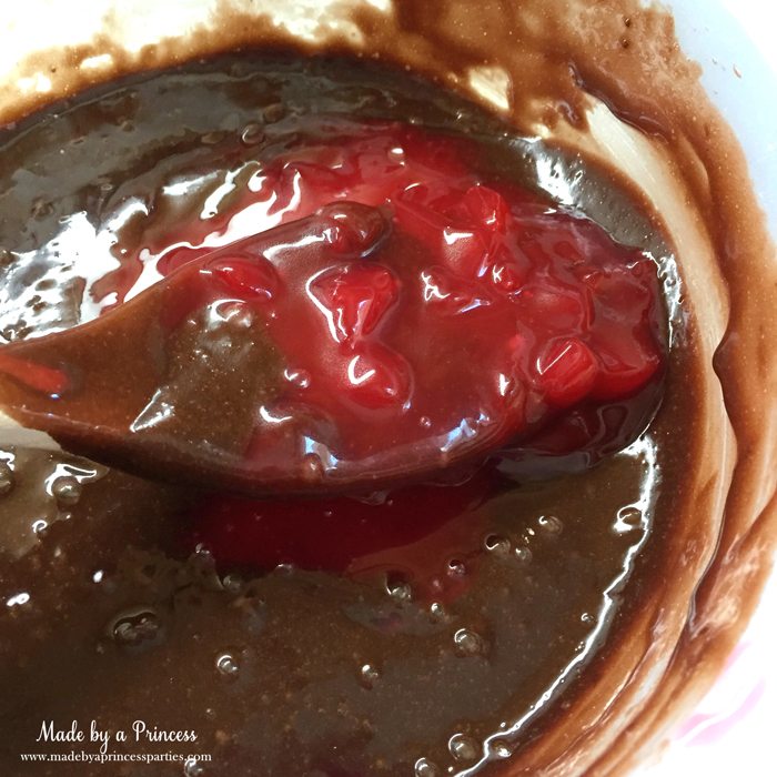 mason-jar-cherry-brownies-mix-filling-into-brownie-batter