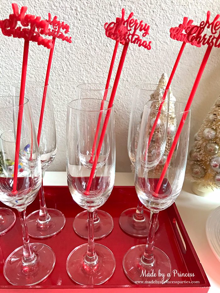 budget-friendly-holiday-mimosa-bar-party-merry-christmas-drink-stirrers-in-glasses