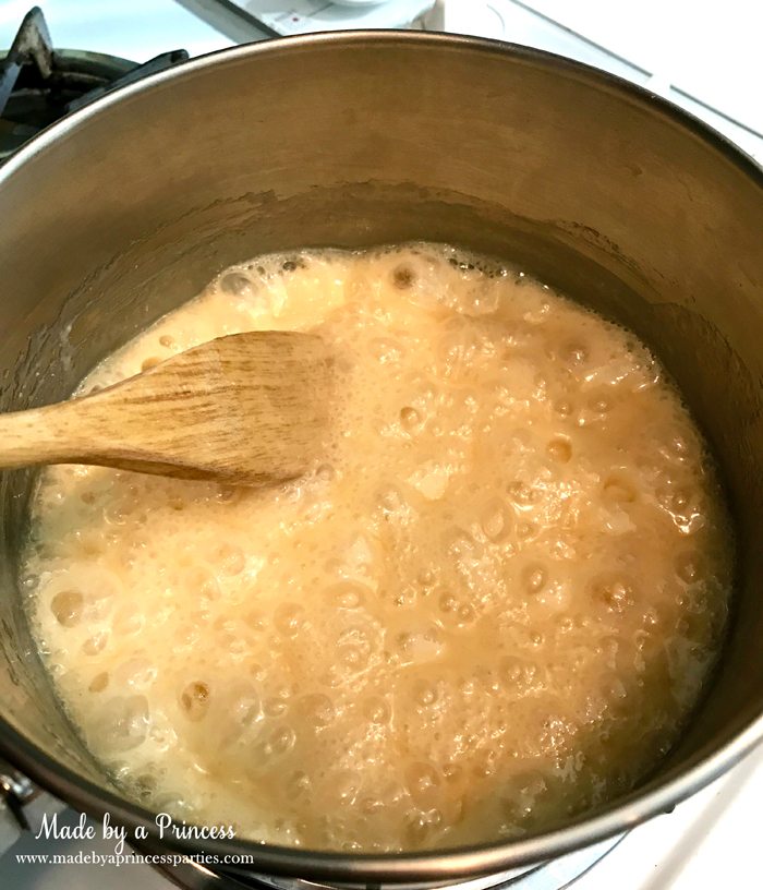 marshmallow-creme-brulee-fudge-recpe-stir-with-wooden-spoon