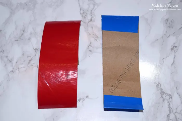Party-Costume-Idea-How-to-Make-Superhero-Cuffs-place-duct-tape-on-toilet-paper-roll