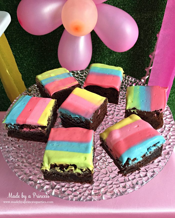 Unicorn Party Rainbow Brownies Recipe place brownies on a pretty platter