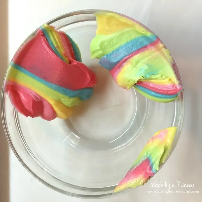 Unicorn Party Rainbow Brownies Recipe scrape frosting into a bowl and use to decorate cupcakes