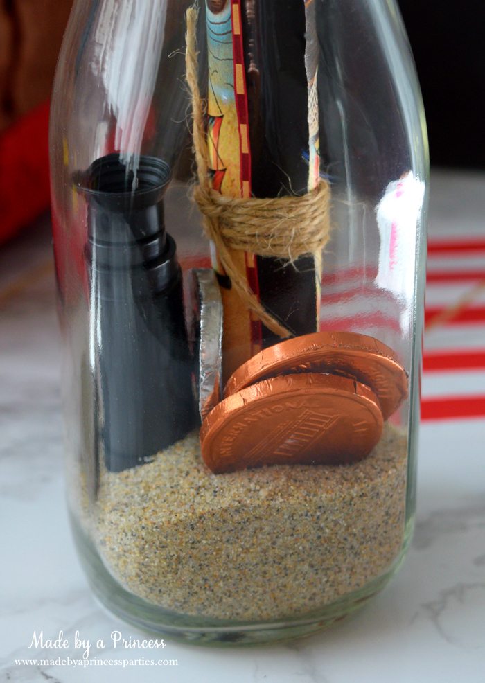 Pirate Bottle Invitations Party Idea place invite coins and scope in glass milk bottle with sand