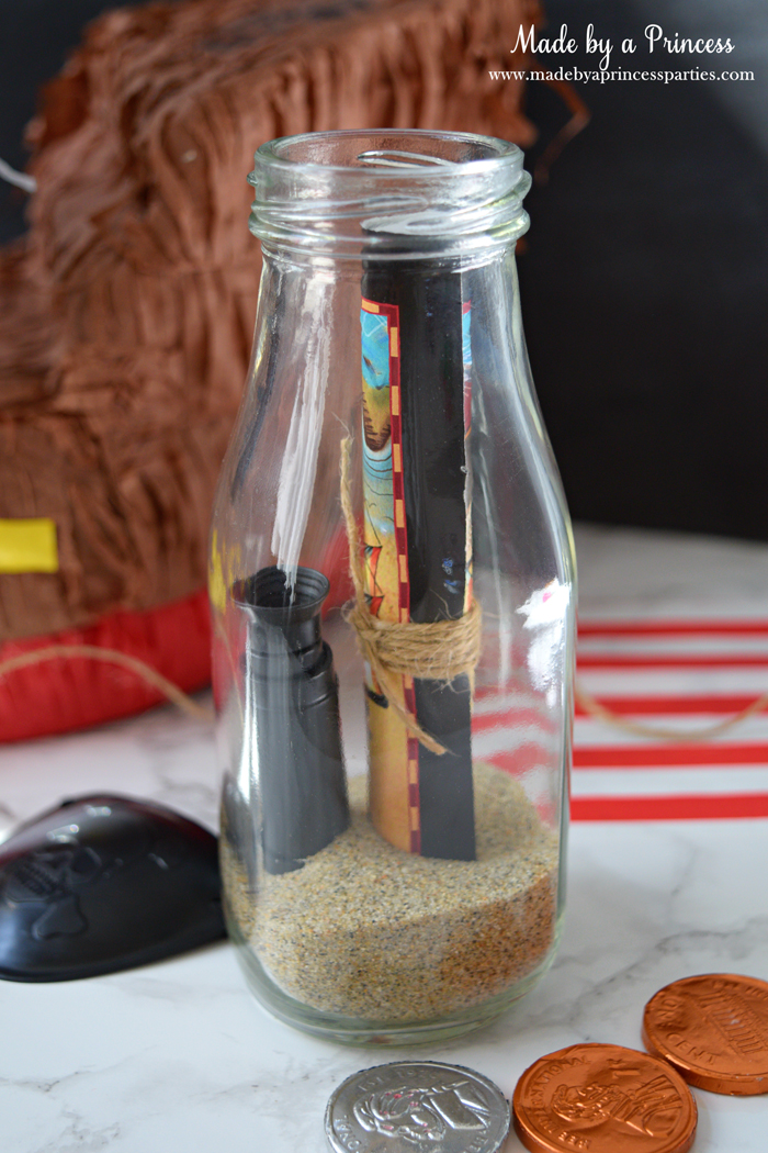 Pirate Bottle Invitations Party Idea place rolled invite in glass milk bottle with sand