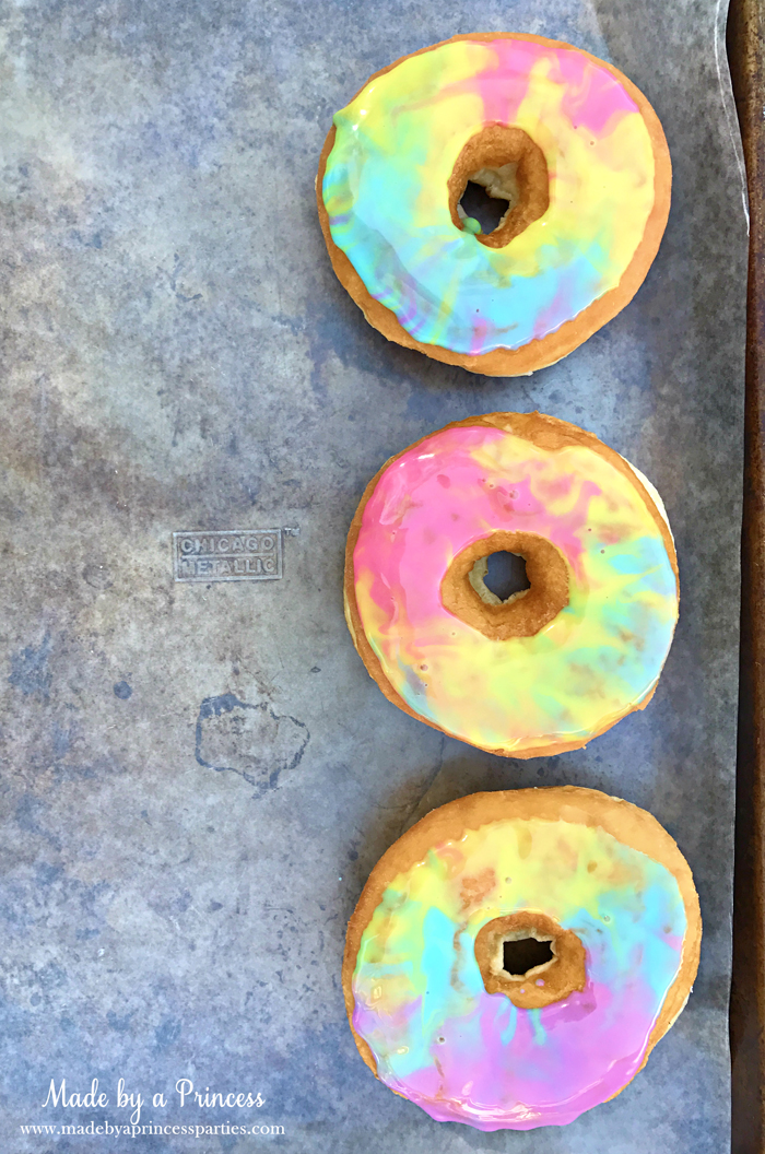 Marbled Rainbow Donuts Party Food Tutorial place donuts on wax paper on a cookie sheet