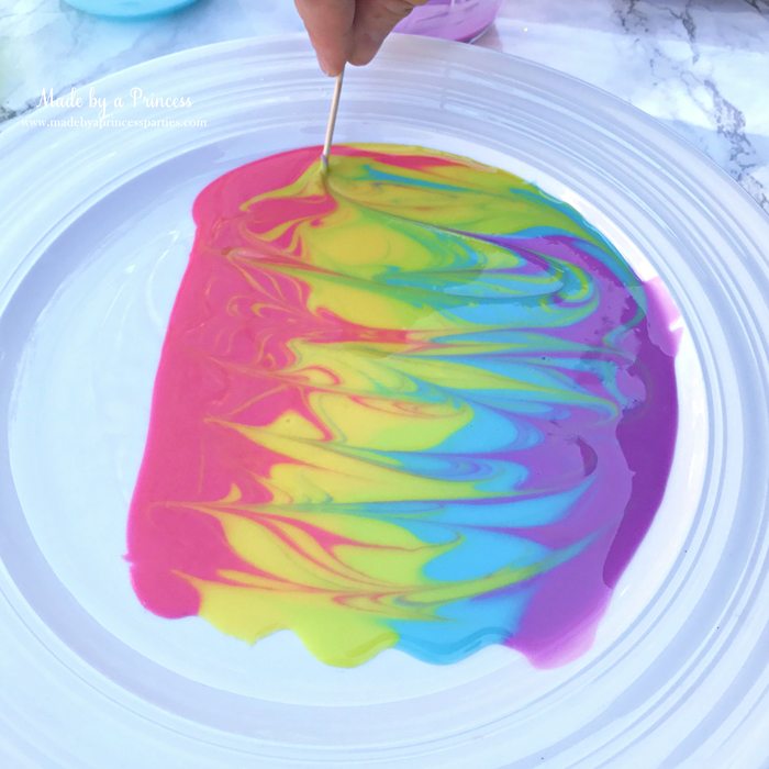 Rainbow Donuts Party Food Tutorial take a toothpick and swirl the glaze make pretty patterns
