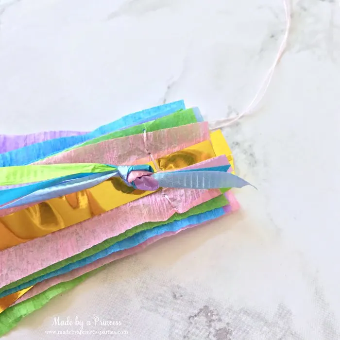 unicorn princess party hat idea tutorial tie curling ribbon together and place on crepe and gold fringe layers