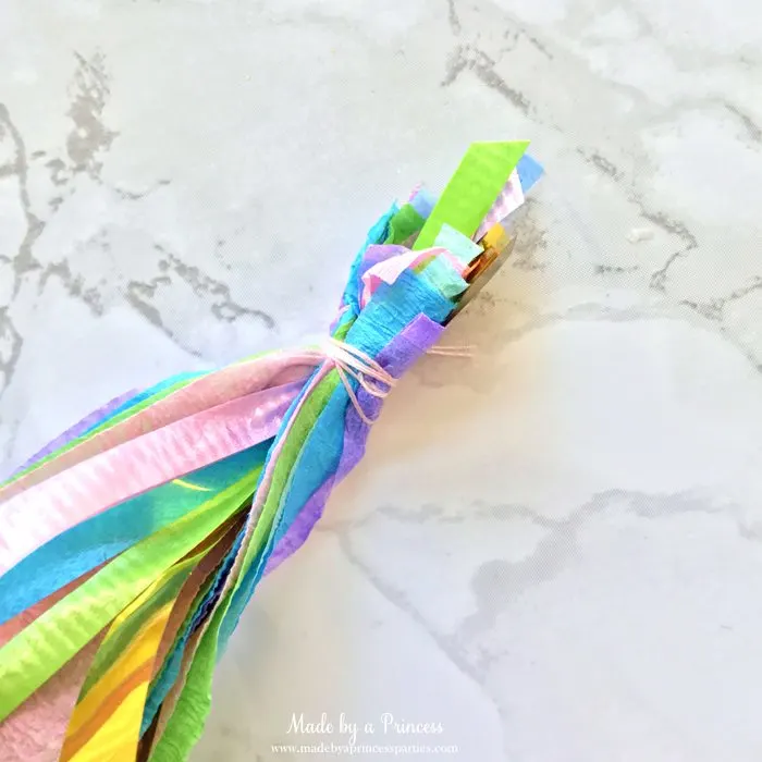 unicorn princess party hat idea tutorial wrap thread around crepe layers and curling ribbon