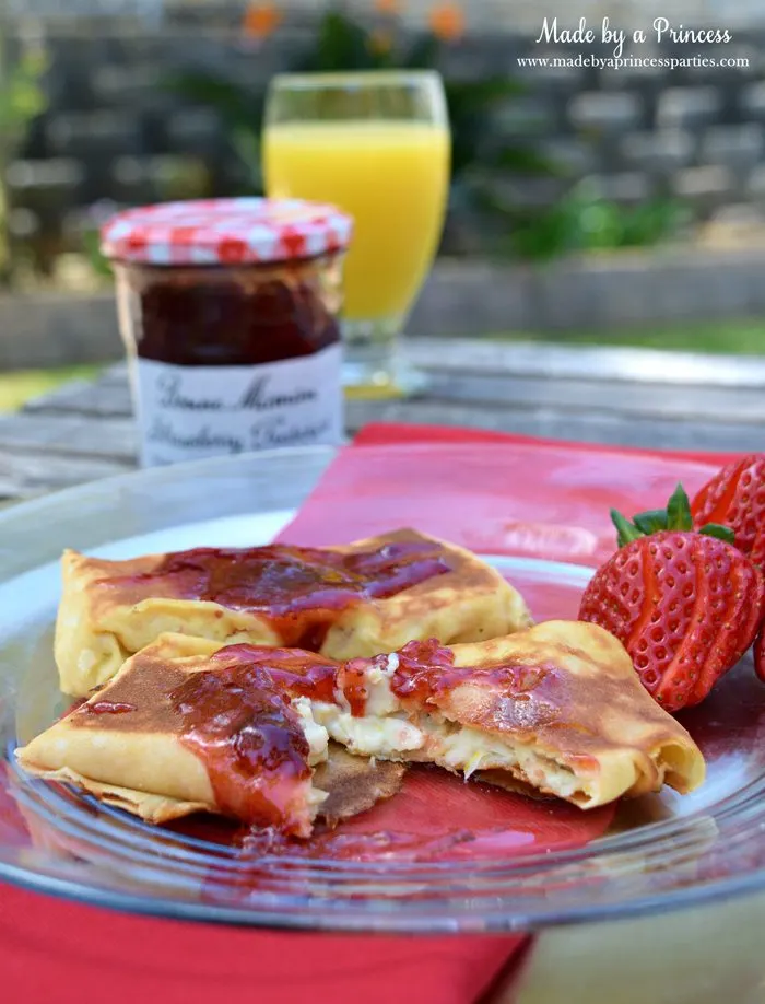 Savory Strawberry Preserves Toasted Coconut Almond Chicken Blintz Recipe served with orange juice