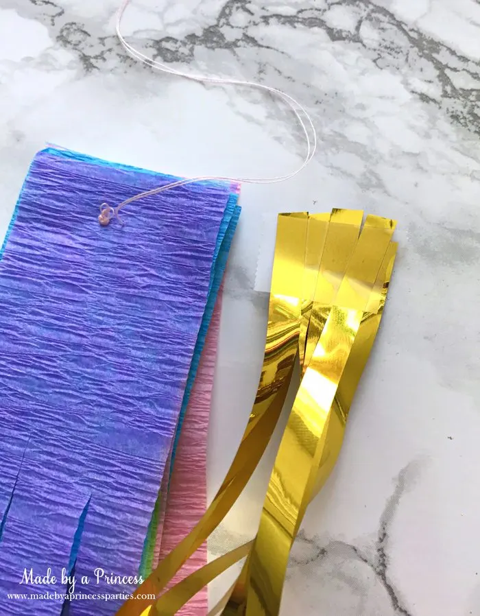 unicorn tail party idea tutorial add another section of gold fringe curtain about the same width as crepe paper