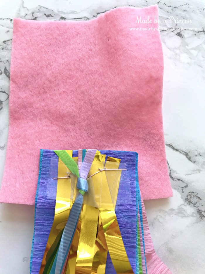 unicorn tail party idea tutorial glue piece of felt to streamers