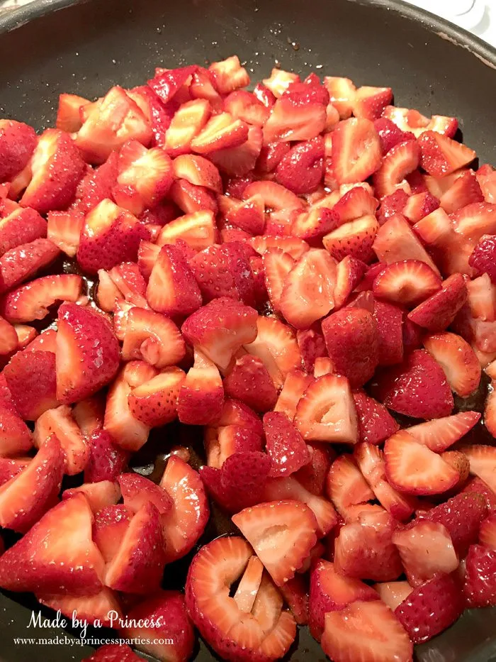 strawberry almond cobbler place strawberries and sugar in a pan | Made by a Princess
