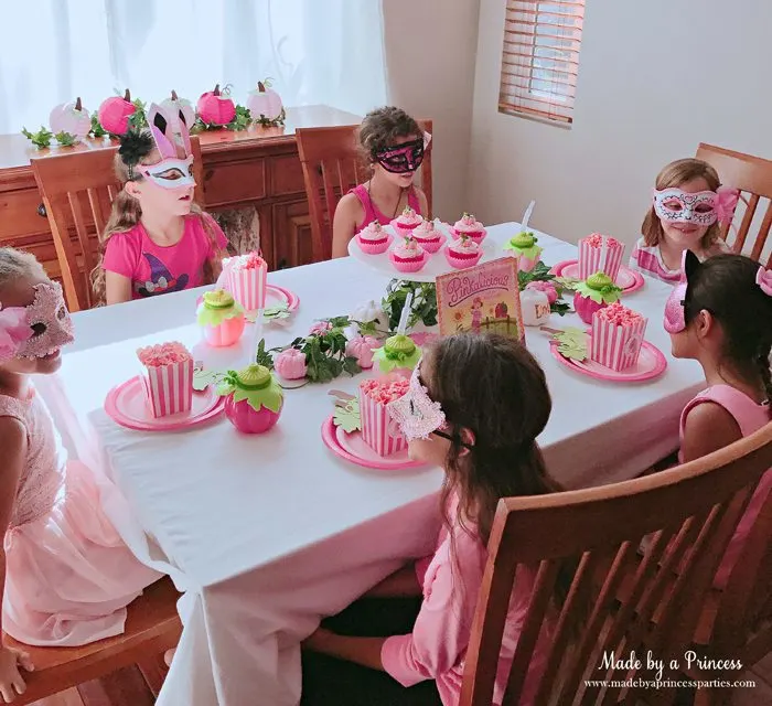 Pink Pumpkin Halloween Party Ideas girls chatting over pink popcorn Made by a Princess #pinkparty #pinkoween #pinkpumpkinparty