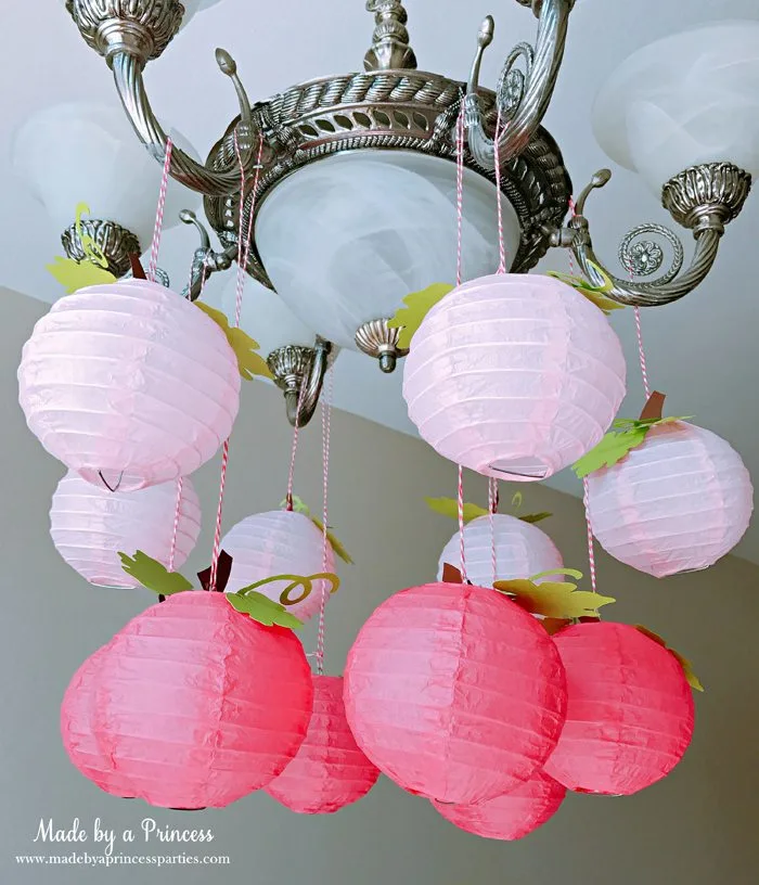 Pink Pumpkin Halloween Party Ideas paper lanterns turned to pumpkins Made by a Princess #pinkparty #pinkoween #pinkpumpkinparty