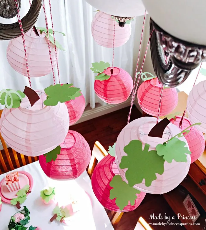 Pink Pumpkin Halloween Party Ideas pink pumpkin paper lantern chandelier Made by a Princess #pinkparty #pinkoween #pinkpumpkinparty