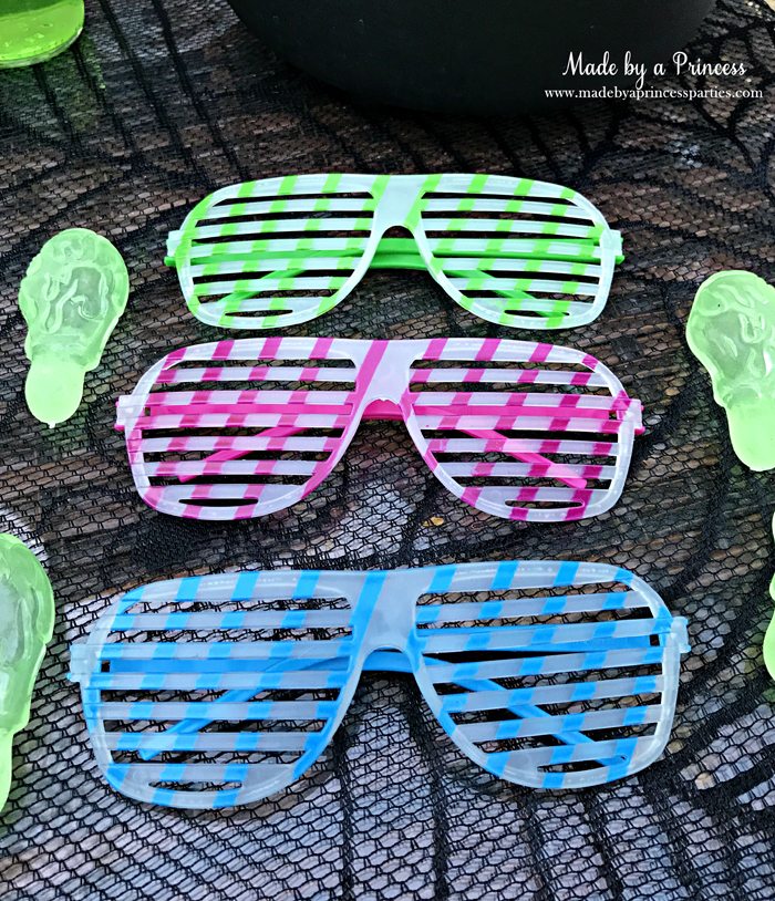 Teen Halloween Party Ideas glow in the dark sunglasses and snot rockets Made by a Princess #halloweenparty #teenhalloween