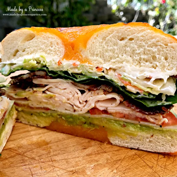 Best Turkey BLT Sandwich Recipe filled with avocado. swiss cheese. cole slaw. and candied bacon via @madebyaprincess #turkeysandwich #blt #bltsandwich #bestsandwich #recipe #turkeyblt