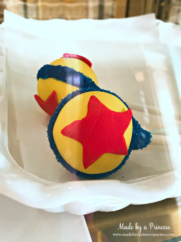 Disneylands Best Pixar Fest Food Checklist Pixar Ball Cake Pops #disneylandfood #disneyfood #toystory #pixarfest #madebyaprincess