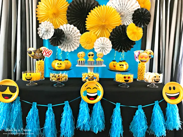 Emoji party idea use a garland and emoji party plate to decorate