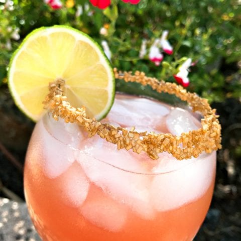 Copycat Disney Rose Gold Margarita garnish with gold sprinkles #disneycocktail #rosegoldmargarita #copycatdisneyrecipe @madebyaprincess