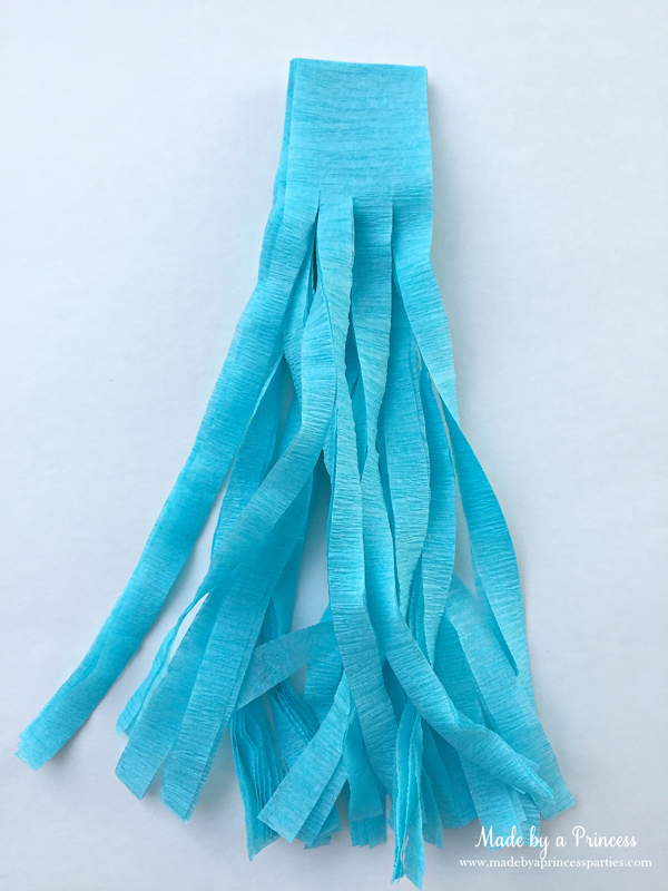 How to Make Tassel Garland with Crepe Paper fringe the crepe paper by cutting into strips