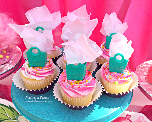 Shopkins Birthday Party Ideas use Shopkins shopping bags with tissue paper as cupcake toppers