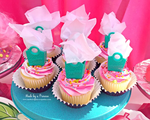 Shopkins Birthday Party Ideas use Shopkins shopping bags with tissue paper as cupcake toppers