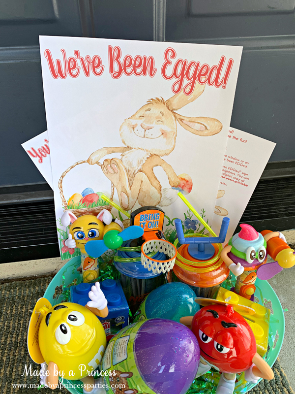 You've Been Egged Poem Printable Easter Activity basket of candy on the front porch