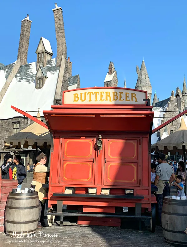 Buy Butterbeer at the Butterbeer cart in Hogsmeade