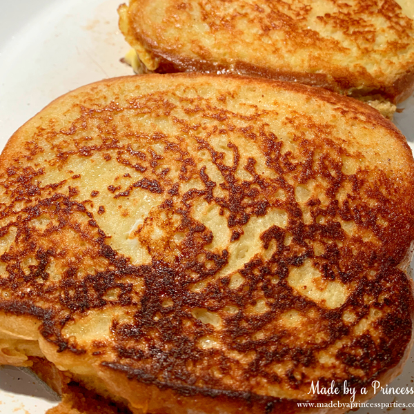 Cook marzipan stuffed french toast in a pan about 5 minutes on each side on low heat until golden