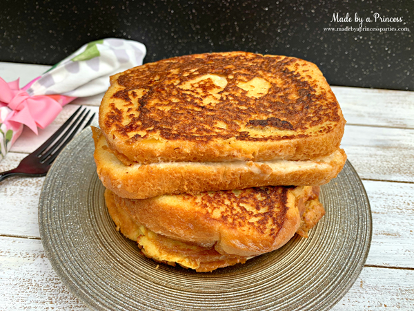Once marzipan stuffed french toast is golden brown on both sides plate and serve