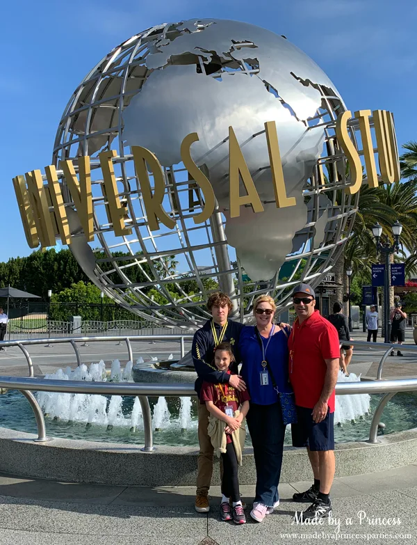 Picture of the family in front of the Universal Studios globe