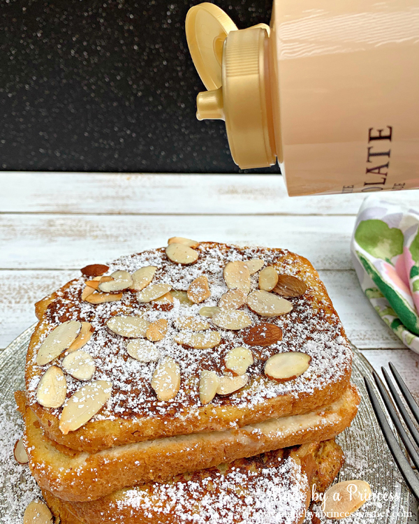 Pour Torani White Chocolate Sauce on top of marzipan stuffed french toast