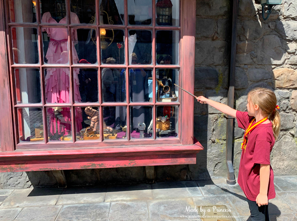 Universal Studios Hollywood make the making tape go up and down with your wand in the window at Gladrags