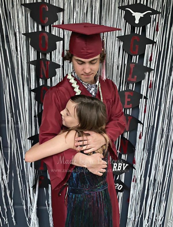 Use the Cricut Joy to cut a continuous roll of vinyl letters for a graduation garland