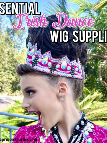 Side profile of an Irish dancer with a big smile in a high bun wig and bright pink sparkly competition dress